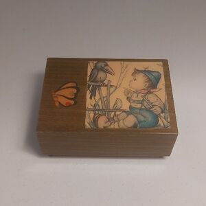 Vintage Wooden Music Box with Child and Bird Illustration